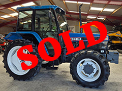 Side view of the blue FORD NEW HOLLAND 6640 SL DP tractor