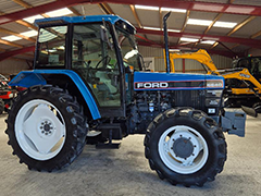 Side view of the blue FORD NEW HOLLAND 6640 SL DP tractor