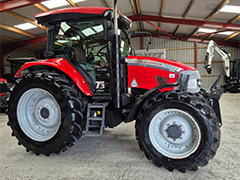 Side view of the red MCCORMICK MC115